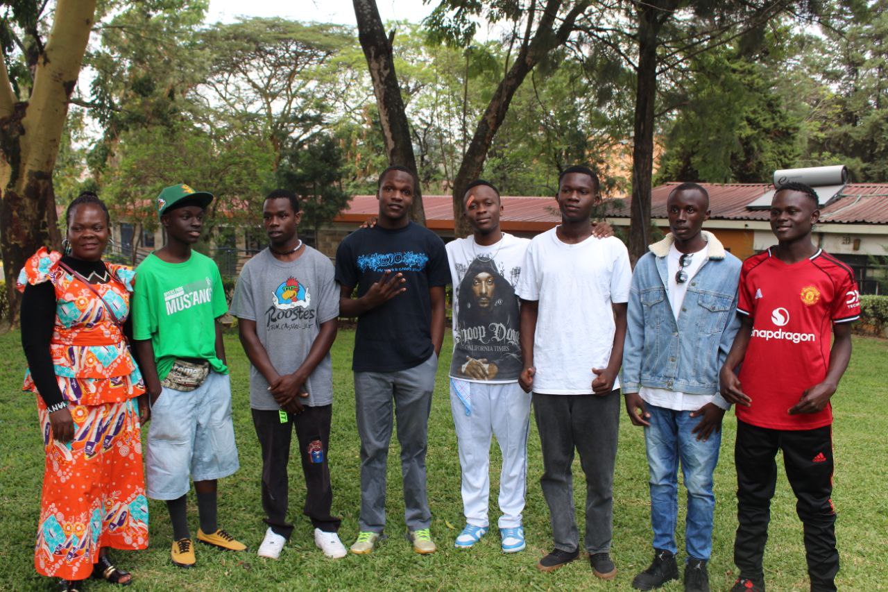 Young men with caregiver at KCH